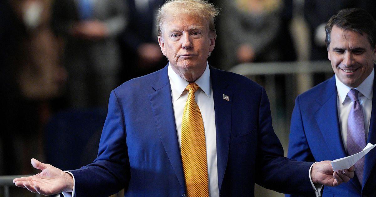 Former President Donald Trump speaks to the media before he appears in court during his trial at the Manhattan Criminal Court in New York City on Tuesday.