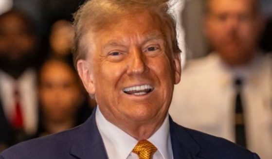 Former President Donald Trump speaks to the media as he arrives to attend his trial at the Manhattan Criminal Court in New York City on Tuesday.