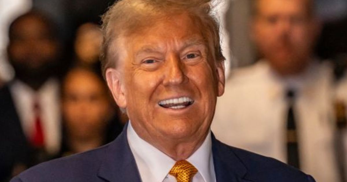 Former President Donald Trump speaks to the media as he arrives to attend his trial at the Manhattan Criminal Court in New York City on Tuesday.