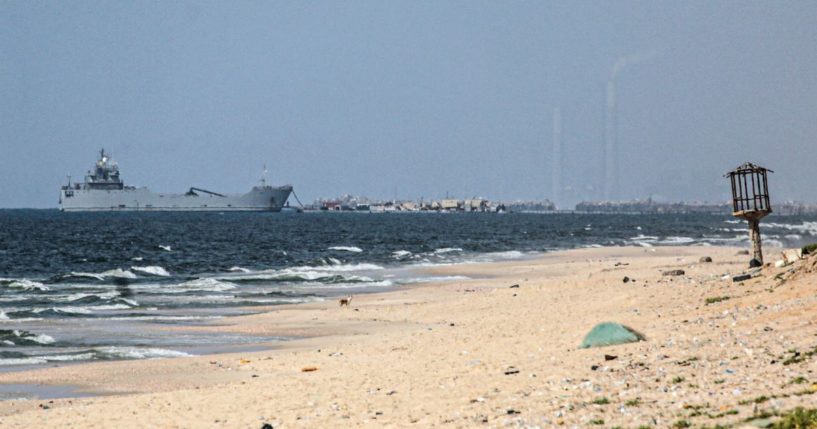 A ship transporting international humanitarian aid is moored at the U.S.-built floating pier near Nuseirat in the Gaza Strip on Tuesday.