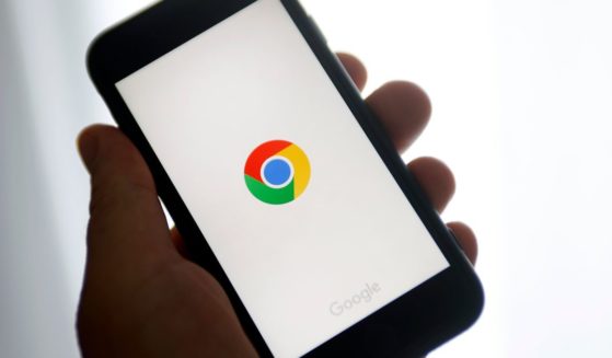 A photo illustration shows the Google Chrome logo displayed on the screen of an iPhone in Paris on June 8, 2023.