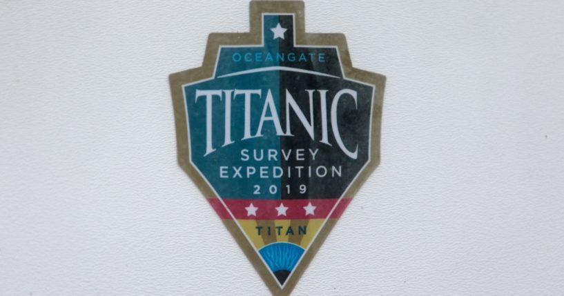 A decal, which reads "Titanic Survey Expedition 2019 Titan," is pictured on a window at OceanGate at the Port of Everett Boat Yard in Everett, Washington, on June 20, 2023.