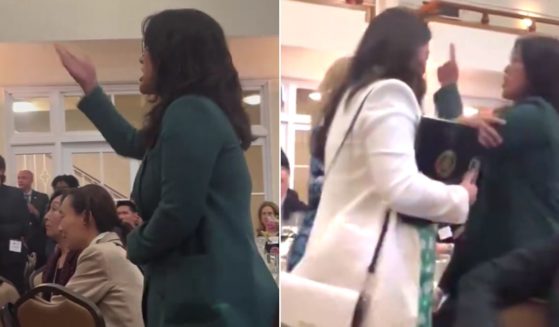 The protester continued shouting at Pelosi until she was escorted out of the facility.