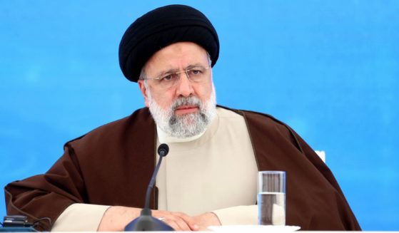 Iranian President Ebrahim Raisi looks on during a ceremony marking the raising the Qiz Qalasi Dam, constructed on the Aras River on the joint borders between Iran and Azerbaijan, in Jabrayil, Azerbaijan, on Sunday. He died in a helicopter crash on the way home.