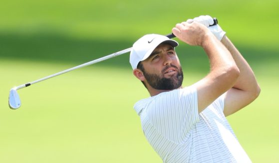 U.S. golfer Scottie Scheffler plays a second shot to make an eagle Thursday on the first hole during the first round of the 2024 PGA Championship at Valhalla Golf Club in Louisville, Kentucky.