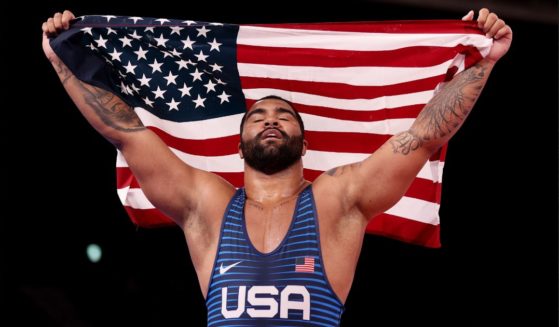 Gable Dan Steveson is seen celebrating his gold-medal win on Aug. 6, 2021, during the Men’s Freestyle 125kg wrestling match at the Tokyo Olympic Games.