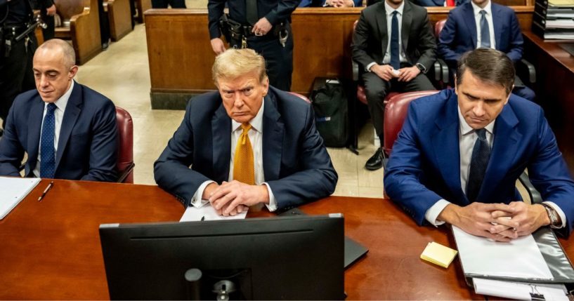 Former President Donald Trump, center, appears in court with attorneys Emil Bove, left, and Todd Blanche, right, for his trial at the Manhattan Criminal Court in New York City on Tuesday.