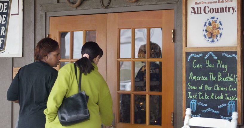 Two women enter a Cracker Barrel Old Country Store restaurant in 2002. These days, the chain is struggling.