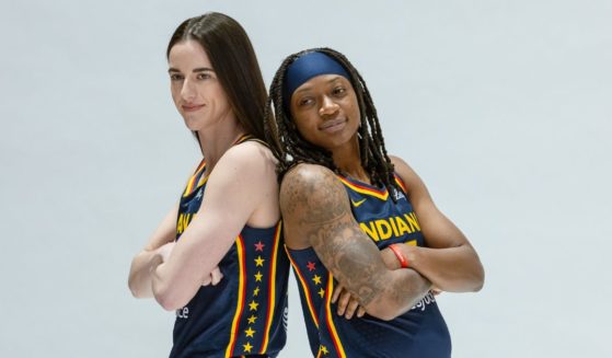 Caitlin Clark, left, and Erica Wheeler pose during the Indiana Fever's media-day activities Wednesday at Gainbridge Fieldhouse in Indianapolis.