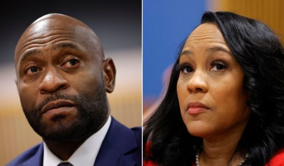 Special prosecutor Nathan Wade, left, and Fulton County District Attorney Fani Willis, right, are seen in court during a hearing at the Fulton County Courthouse in Atlanta on March 1.