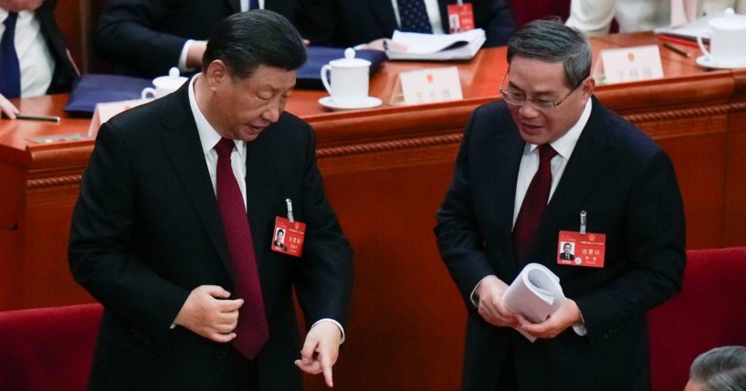 Xi Jinping chatting after the opening session of the National People's Congress in Beijing