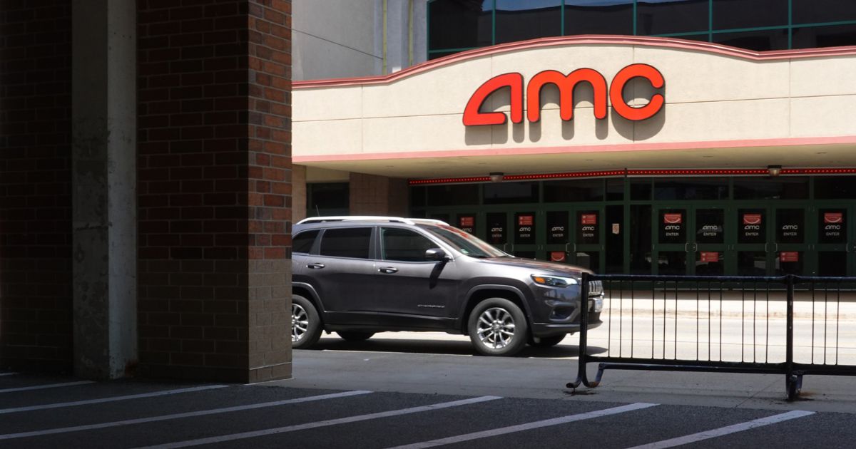 A sign hangs outside of an AMC theater on June 1, 2021 in Skokie, Illinois.