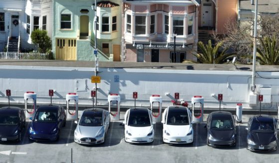 In an aerial view, Tesla cars recharge at a Tesla Supercharger station on Feb. 15, 2023, in San Francisco, California.