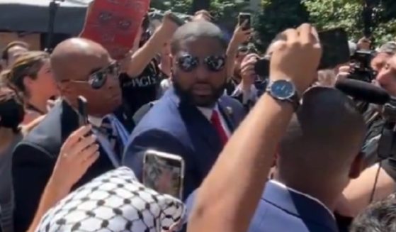 U.S. Rep. Byron Donalds of Florida turns to face a heckler on Wednesday on the campus of George Washington University.