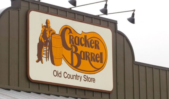 A Cracker Barrel Old Country Store sign is visible atop one of its restaurant stores on April 12, 2002, in Naperville, Illinois.