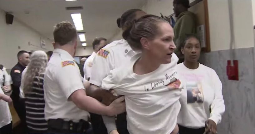 court officers separating brawlers in the aftermath of a physical altercation in a courthouse