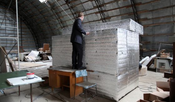 Head of Russian cryonics firm KrioRus Danila Medvedev looks inside a liquid nitrogen filled human storage unit just outside Moscow on June 17, 2010. Cryonics -- or the freezing of humans in the hope of future resuscitation -- is illegal in France and much of the world, but KrioRus has stored four full bodies and eight people's heads in liquid nitrogen-filled metal vats.