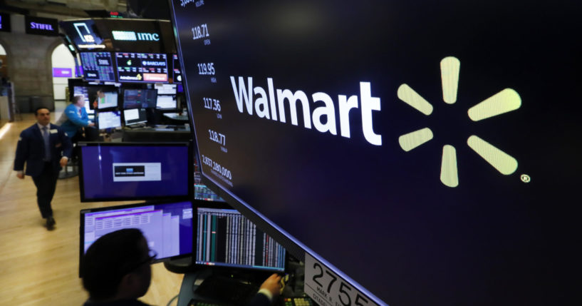 In this Feb. 18, 2020 file photo, the logo for Walmart appears above a trading post on the floor of the New York. Walmart has ended a partnership with Capital One that made the banking company the exclusive issuer of Walmart’s consumer credit cards. The companies announced the change in a joint statement Friday, May 24, 2024.