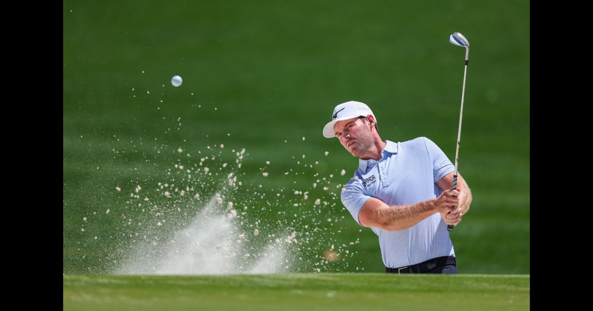 Grayson Murray hits out of a greenside bunker on the first hole during the third round of the Wells Fargo Championship at Quail Hollow Country Club on May 11, 2024 in Charlotte, North Carolina.