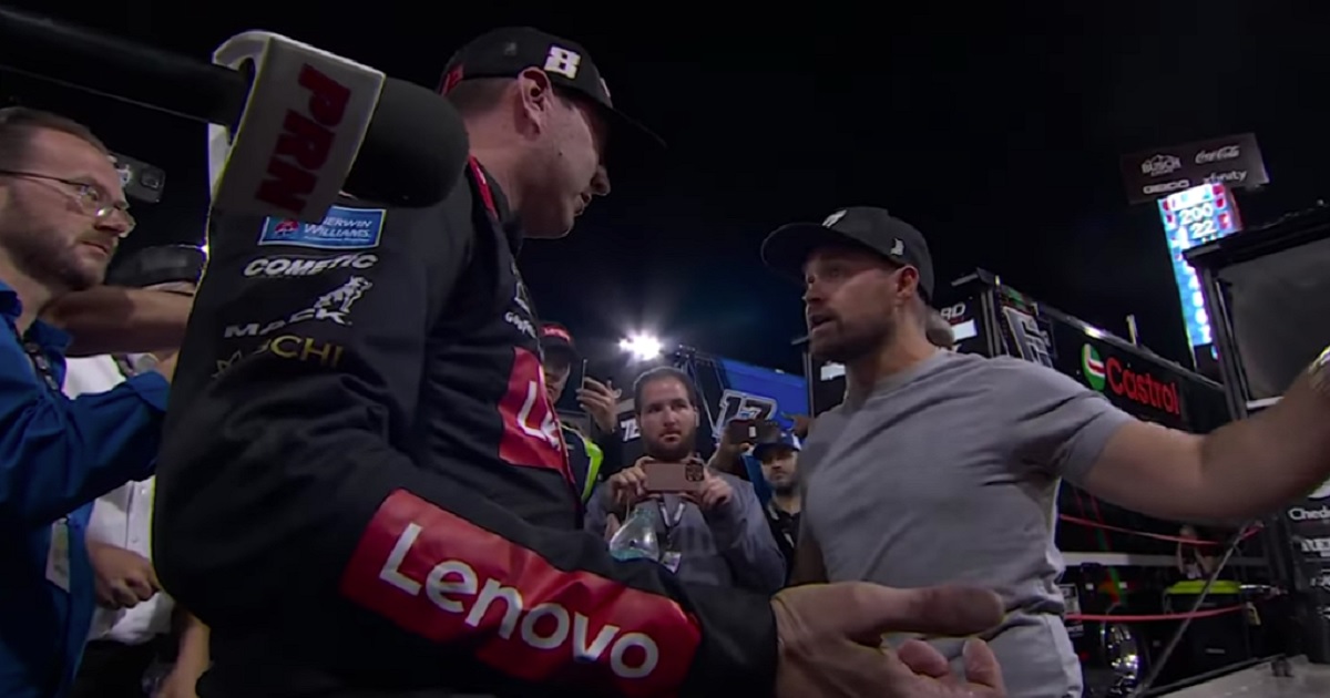 NASCAR drivers Kyle Busch, left, and Ricky Stenhouse Jr. exchange words before a fistfight Sunday in North Wilkesboro, North Carolina.