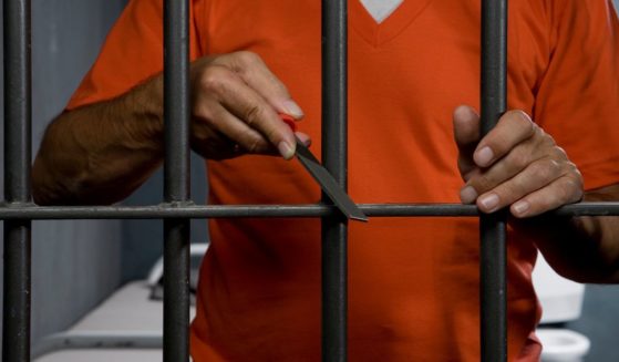 This Getty stock image shows a prison inmate trying to escape his cell.