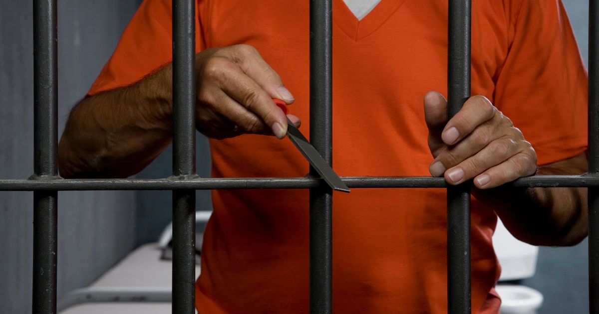 This Getty stock image shows a prison inmate trying to escape his cell.