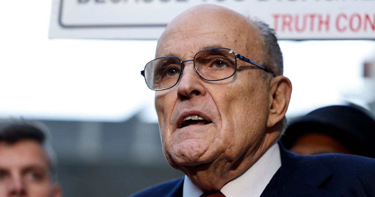 Rudy Giuliani, the former personal lawyer for former U.S. President Donald Trump, speaks with reporters outside of the E. Barrett Prettyman U.S. District Courthouse after a verdict was reached in his defamation jury trial on December 15, 2023 in Washington, DC.