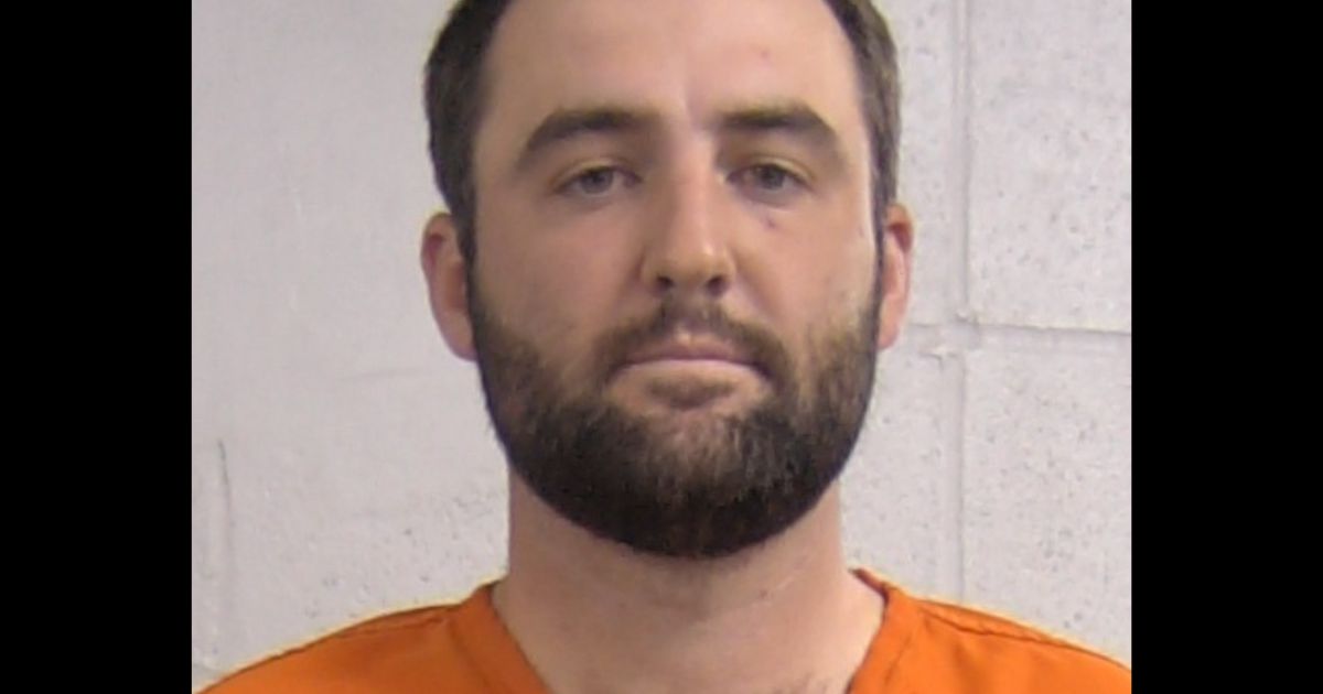 This X screen shot shows the mug shot of pro golfer Scottie Scheffler, who was detained on the morning of May 17, 2024 in Louisville, Kentucky.