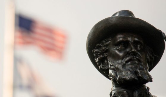 The American flag flies behind the statue of Confederate Gen. Thomas Stonewall Jackson at the West Virginia State Capitol Complex on Aug. 16, 2017, in Charleston.