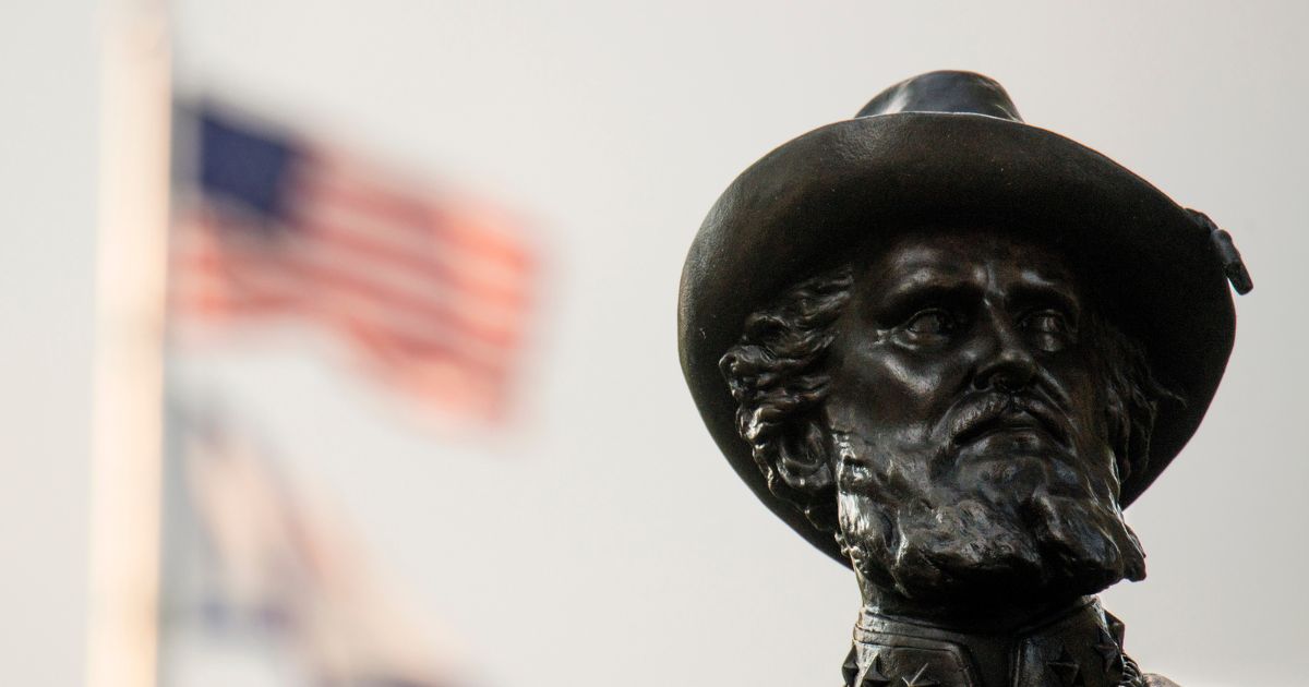 The American flag flies behind the statue of Confederate Gen. Thomas Stonewall Jackson at the West Virginia State Capitol Complex on Aug. 16, 2017, in Charleston.