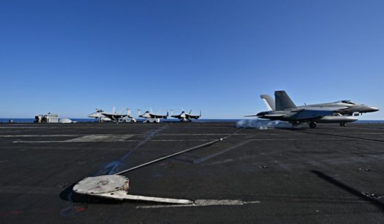 An F/A-18 Hornet fighter jet landing on the deck of the US Nimitz-class nuclear-powered aircraft carrier USS Harry S. Truman, during a NATO vigilance activity NEPTUNE SHIELD 2022 (NESH22) on eastern Mediterranean Sea on May 23, 2022. - NATO is conducting vigilance activity NEPTUNE SHIELD 2022 (NESH22), which integrates high-end maritime expeditionary strike capabilities of Sea, Air and Land assets. The activities are take place in the Baltic, Adriatic and Mediterranean Seas, from 17-31 May.