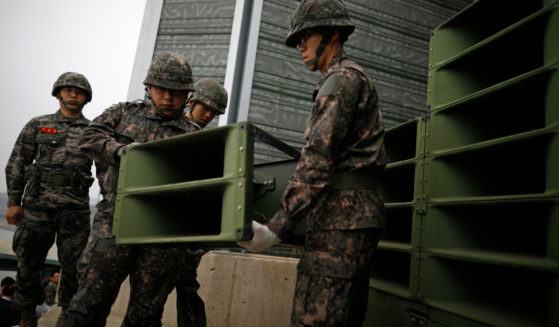 South Korean soldiers dismantle loudspeakers that were set up for propaganda broadcasts near the demilitarized zone separating the two Koreas in Paju, South Korea, on May 1, 2018.
