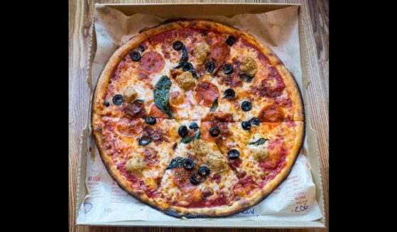 A stock photo shows a custom-made pizza ready for pickup at a Blaze Pizza restaurant in Newark, New Jersey, on Nov. 21, 2015.