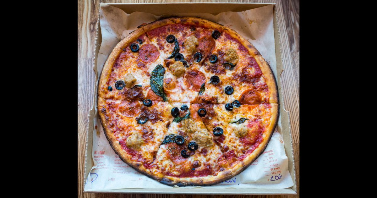 A stock photo shows a custom-made pizza ready for pickup at a Blaze Pizza restaurant in Newark, New Jersey, on Nov. 21, 2015.