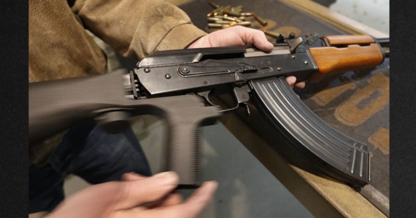 A bump stock is installed on an AK-47 and its movement is demonstrated at Good Guys Gun and Range on Feb. 21, 2018, in Orem, Utah. The bump stock is a device when installed allows a semi-automatic to fire at a rapid rate.