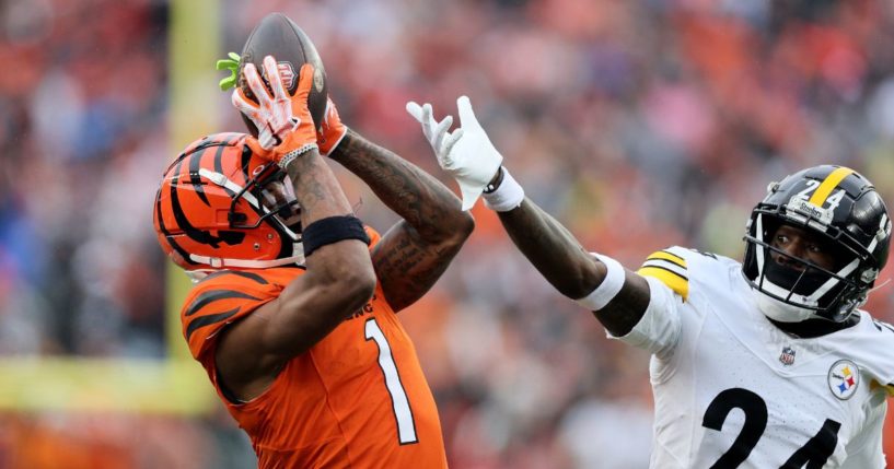 Ja'Marr Chase of the Cincinnati Bengals catches a pass while defended by Joey Porter Jr. of the Pittsburgh Steelers at Paycor Stadium on Nov. 26. Neither team had posted about LGBT "Pride Month" by June 4.