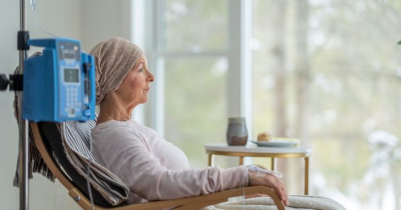 A woman receives a chemotherapy treatment at her home.