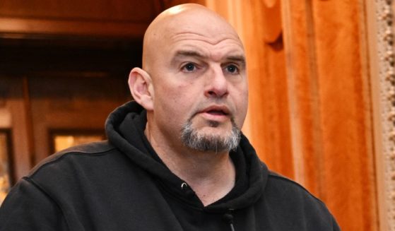 Sen. John Fetterman of Pennsylvania exits the Senate Chamber ahead of a vote on a foreign aid package at the Capitol in Washington on April 23.