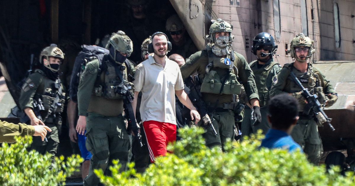 Israeli hostage Andrei Kozlov, 27, disembarks with soldiers from an air force CH-53 Sea Stallion military helicopter after being rescued from Hamas captivity in Gaza on Saturday.