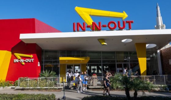 People walk out of an In-N-Out in Westwood in Los Angeles, California in a file photo from February 2022.