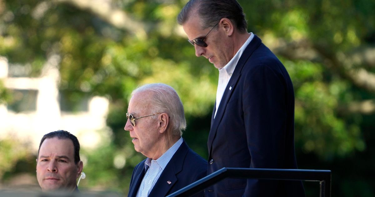President Joe Biden, center, and his son Hunter Biden, right, leave St. Edmond Catholic Church in Rehoboth Beach, Delaware, on Sunday.