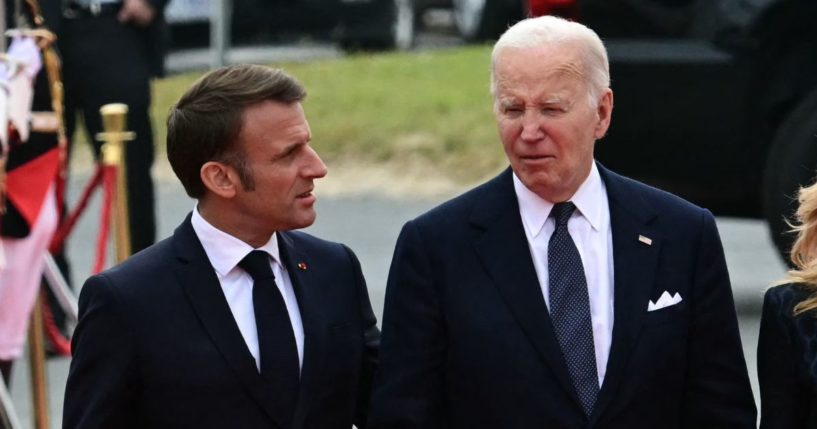 France's President Emmanuel Macron, left, and President Joe Biden arrive for a ceremony at Omaha Beach marking the 80th anniversary of the World War II "D-Day" Allied landings in Normandy, in Saint-Laurent-sur-Mer, in northwestern France, on Thursday.