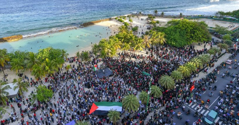 Protesters hold a rally to show support for Palestinians on a beach in Male, Maldives, on Oct. 14, 2023.