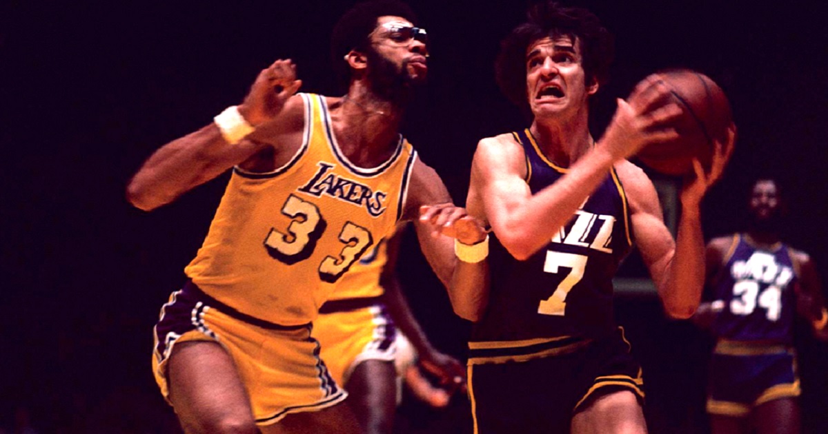 The late “Pistol” Pete Maravich of the New Orleans Jazz drives to the basket while being guarded by the Los Angeles Lakers' Kareem Abdul-Jabbar game on the Lakers home court of The Forum on February 13, 1976.