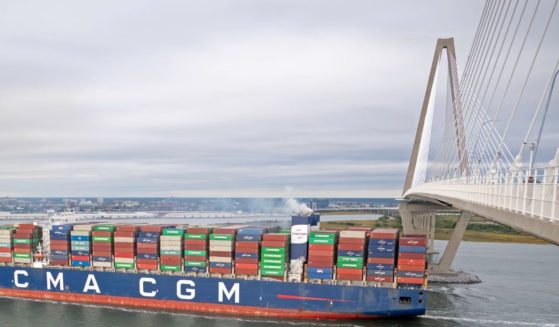 a container ship passing under the Ravenel Bridge in Charleston Harbor