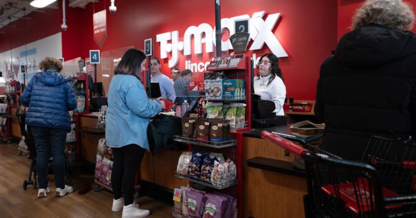 Customers make purchases at a TJ Maxx store in Chicago on Feb. 28.