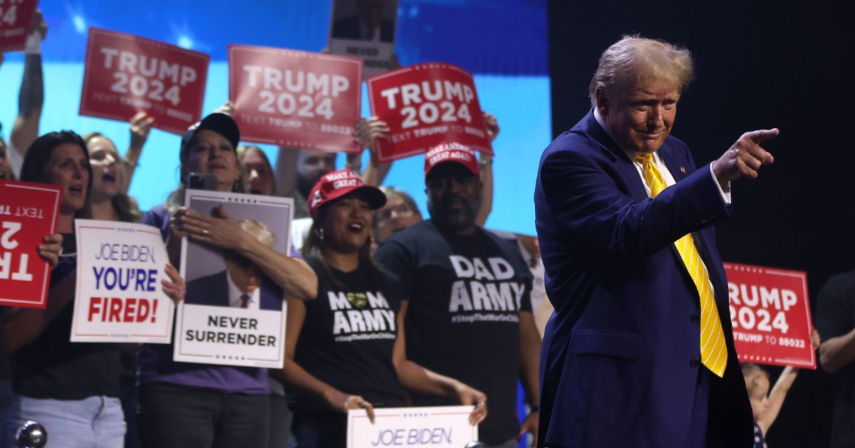 Former President Donald Trump greets supporters during a Turning Point PAC town hall at Dream City Church in Phoenix on Thursday.