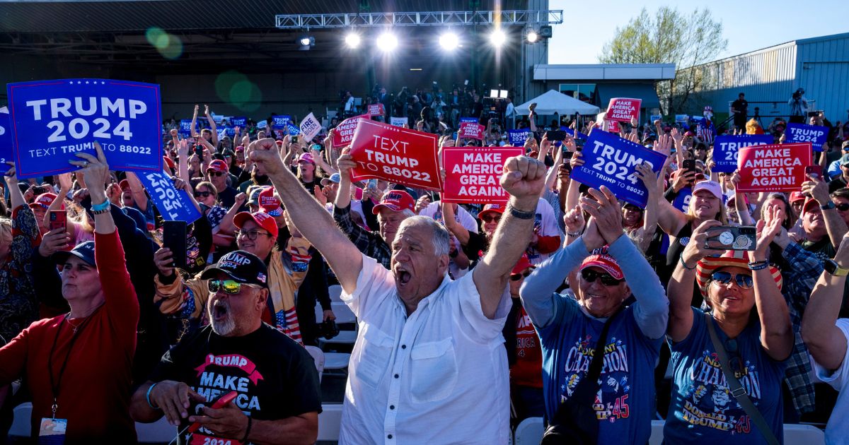 The crowd reacts while former President Donald Trump speaks during a rally in Freeland, Michigan, on May 1.