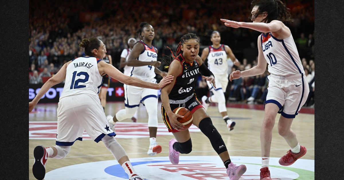 Team USA's Diana Taurasi, left, and Breanna Stewart, right, fight for the ball with Belgium's Maxuella Lisowa Mbaka, center, during the FIBA Women's basketball qualification match for the 2024 Paris Olympics between Belgium and the USA in Antwerp, on Feb.8.