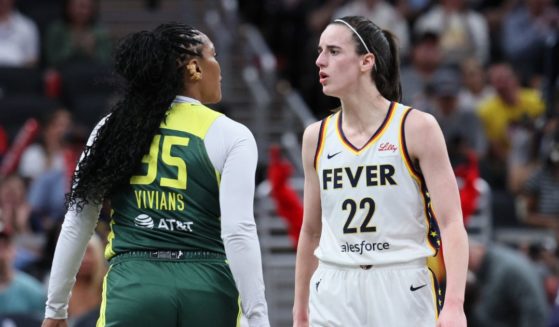 Caitlin Clark #22 of the Indiana Fever exchanges words with Victoria Vivians #35 of the Seattle Storm during the first quarter in the game at Gainbridge Fieldhouse on May 30, 2024 in Indianapolis, Indiana.